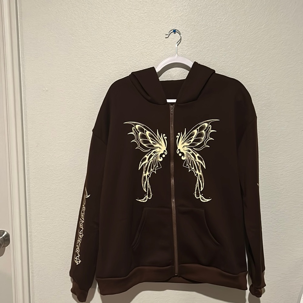 new brown butterfly desing sweter. never used